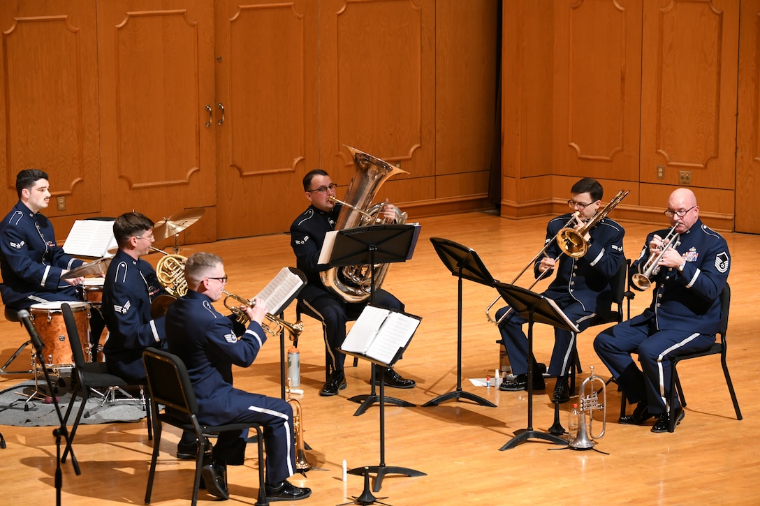 Freedom Brass performs in a concert hall.