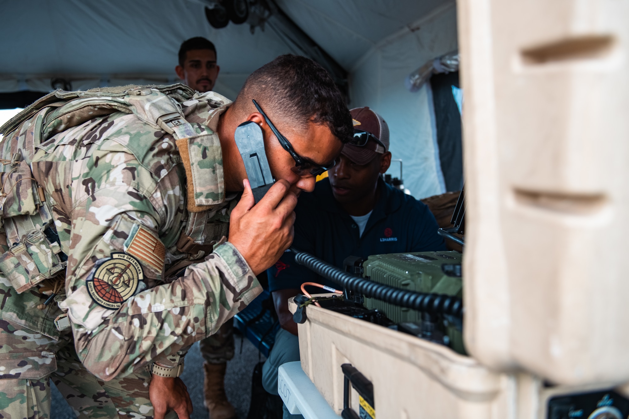 An Airman uses a communications system.