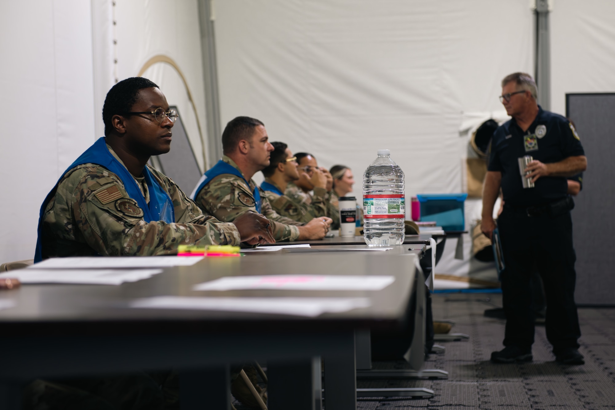 Airmen prepare to check predeployment documents.