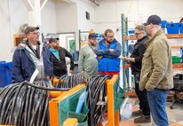 Bryan Weable, right, electrical supervisor, and Andy Allen, operations director, Shop 51, Electricians, lead a tour of Building 427 for ECOP members May 21, 2024, at Puget Sound Naval Shipyard & Intermediate Maintenance Facility in Bremerton, Washington. (U.S. Navy photo by Wendy Hallmark)
