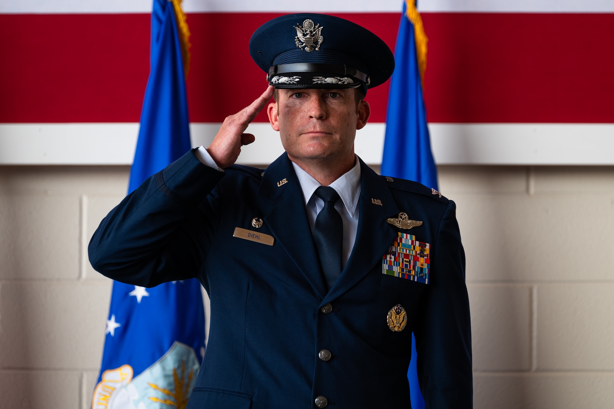 U.S. Air Force Col. Justin Diehl, 317th Airlift Wing commander renders his first salute during a change of command ceremony at Dyess Air Force Base, Texas, July 23, 2024. As the 317th AW commander, he is responsible for organizing, training, and equipping 1,200 combat-ready personnel who operate, maintain, and sustain Dyess’ C-130J aircraft. (U.S. Air Force photo by Airman 1st Class Jade M. Caldwell)