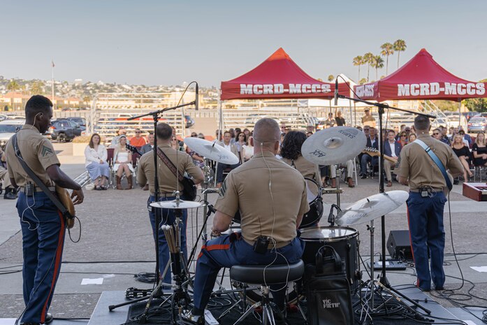 U.S. Marines with Marine Band San Diego’s Popular Music Group, perform their summer concert at Marine Corps Recruit Depot San Diego, California, July 18, 2024. The Marine Band San Diego’s job is to provide ceremonial music, boost morale, participate in outreach work and attend events and ceremonies. (U.S. Marine Corps photo by Lance Cpl. Alexandra M. Earl)
