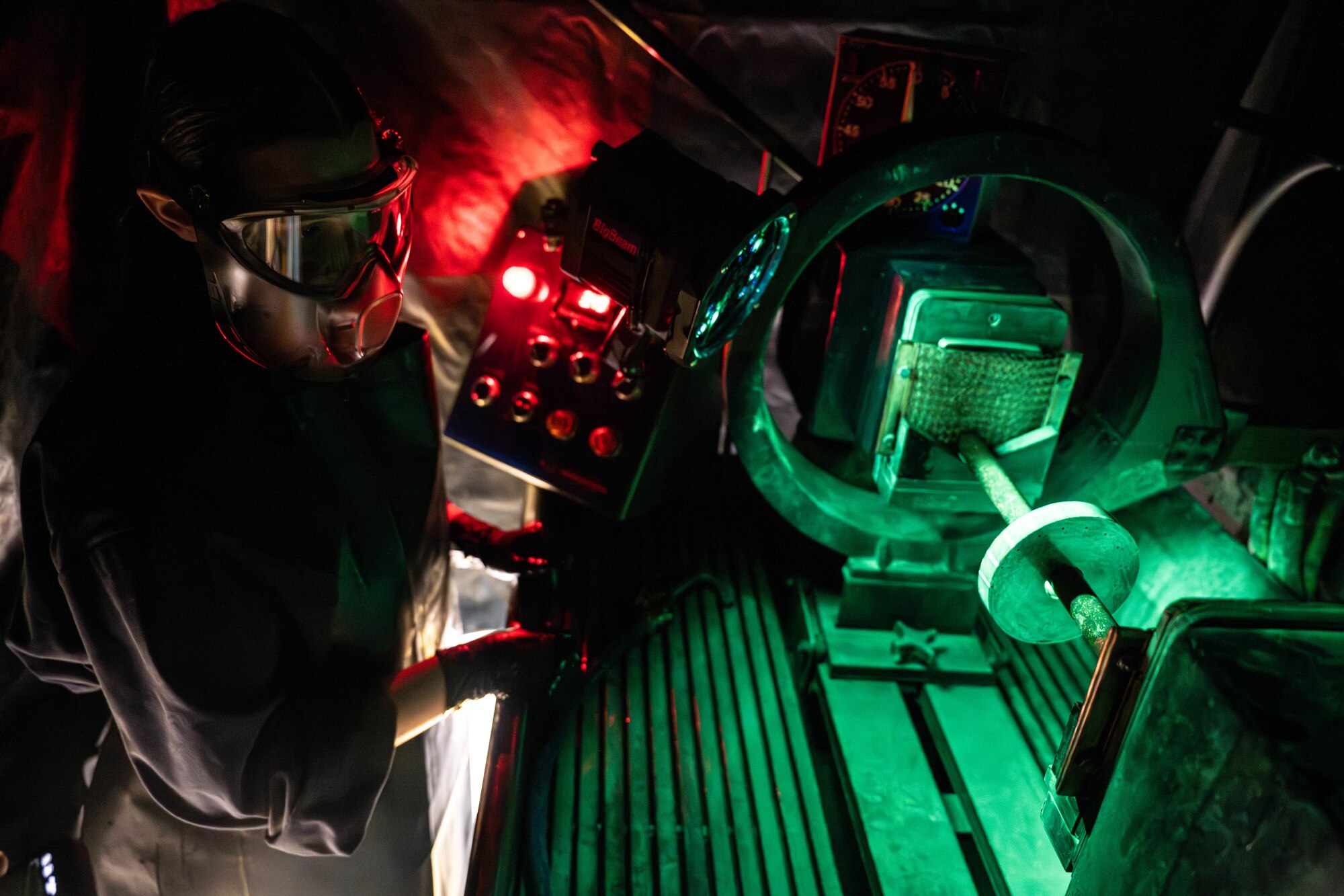 Airman calibrates a magnetic particle machine.