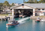 A Coast Guard Station Honolulu 45-foot Response Boat-Medium crew gets underway to conduct a training operation off the coast of Oahu, Hawaii, July 18, 2024. The crew conducted underway training with a Coast Guard Air Station Barbers Point MH-65 Dolphin helicopter crew to maintain proficiencies for search and rescue operations. (U.S. Coast Guard photo by Petty Officer 2nd Class Tyler Robertson)