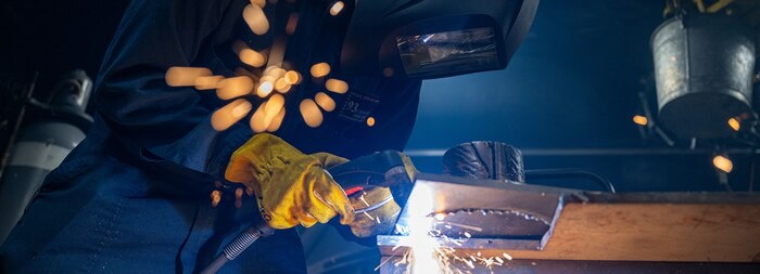 Hull Technician 3rd Class Mario EnriquezSanchez, a Denver native, cuts the baseplate of a 3D printed component aboard the San Antonio-class amphibious transport dock ship USS Somerset (LPD 25) during Exercise Rim of the Pacific (RIMPAC) 2024.