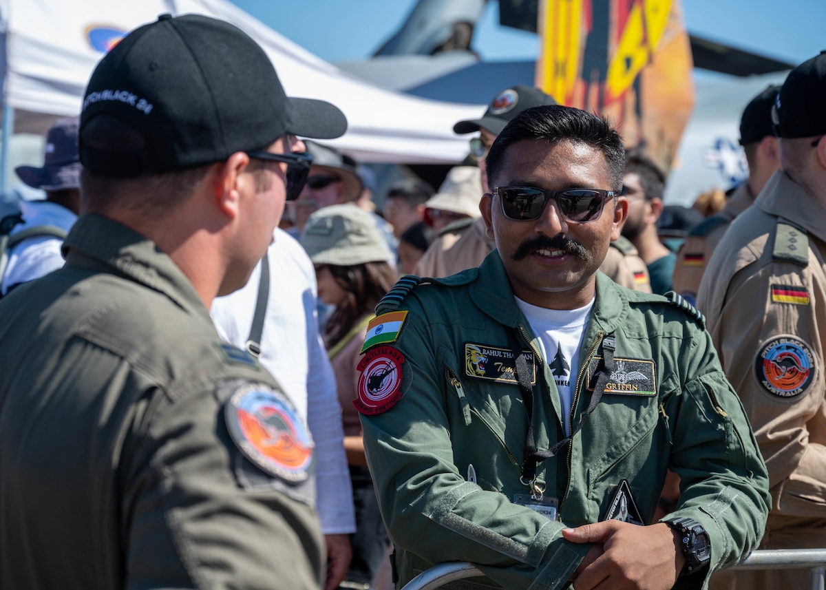 Photo of International Military service members and attendees at Royal Australian Air Force Darwin Open Day Event.
