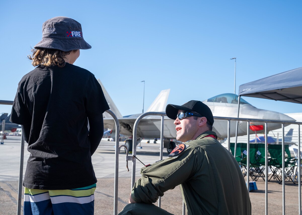 Photo of International Military service members and attendees at Royal Australian Air Force Darwin Open Day Event.