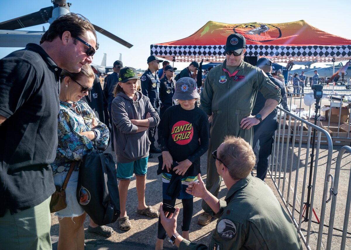 Photo of International Military service members and attendees at Royal Australian Air Force Darwin Open Day Event.