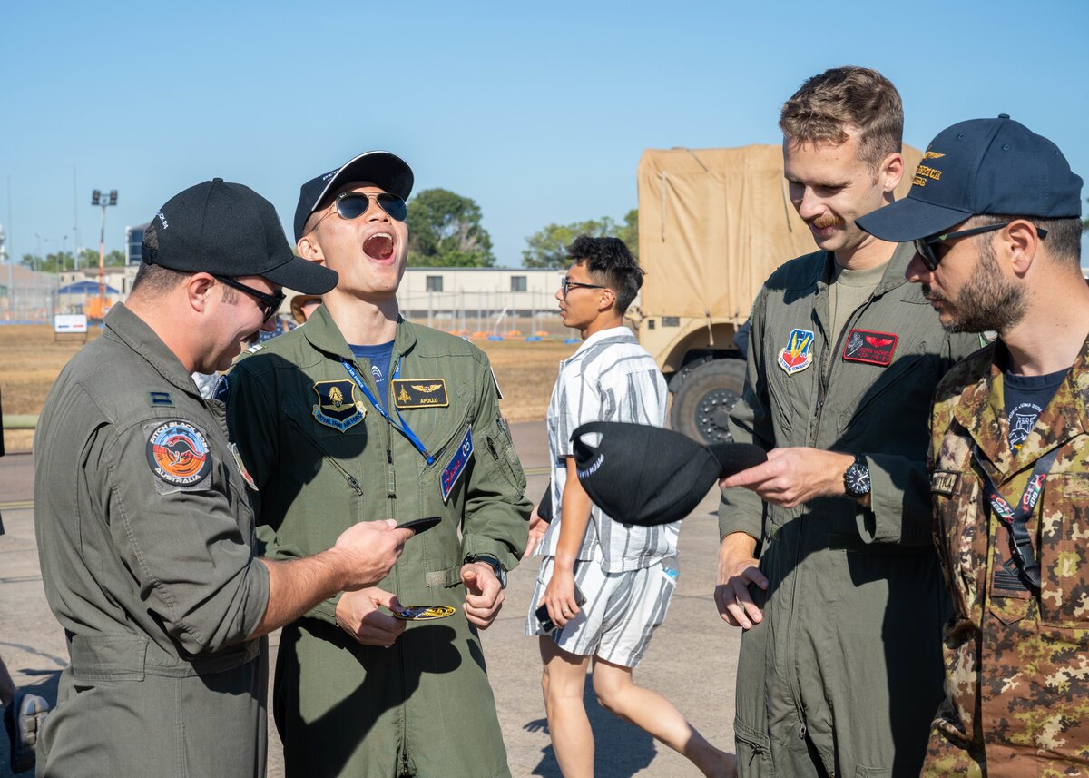 Photo of International Military service members and attendees at Royal Australian Air Force Darwin Open Day Event.