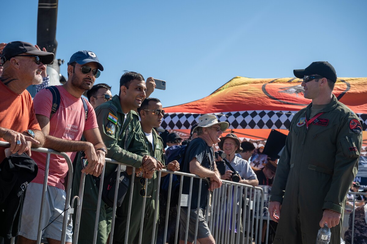Photo of International Military service members and attendees at Royal Australian Air Force Darwin Open Day Event.