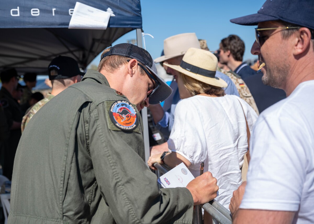 Photo of International Military service members and attendees at Royal Australian Air Force Darwin Open Day Event.