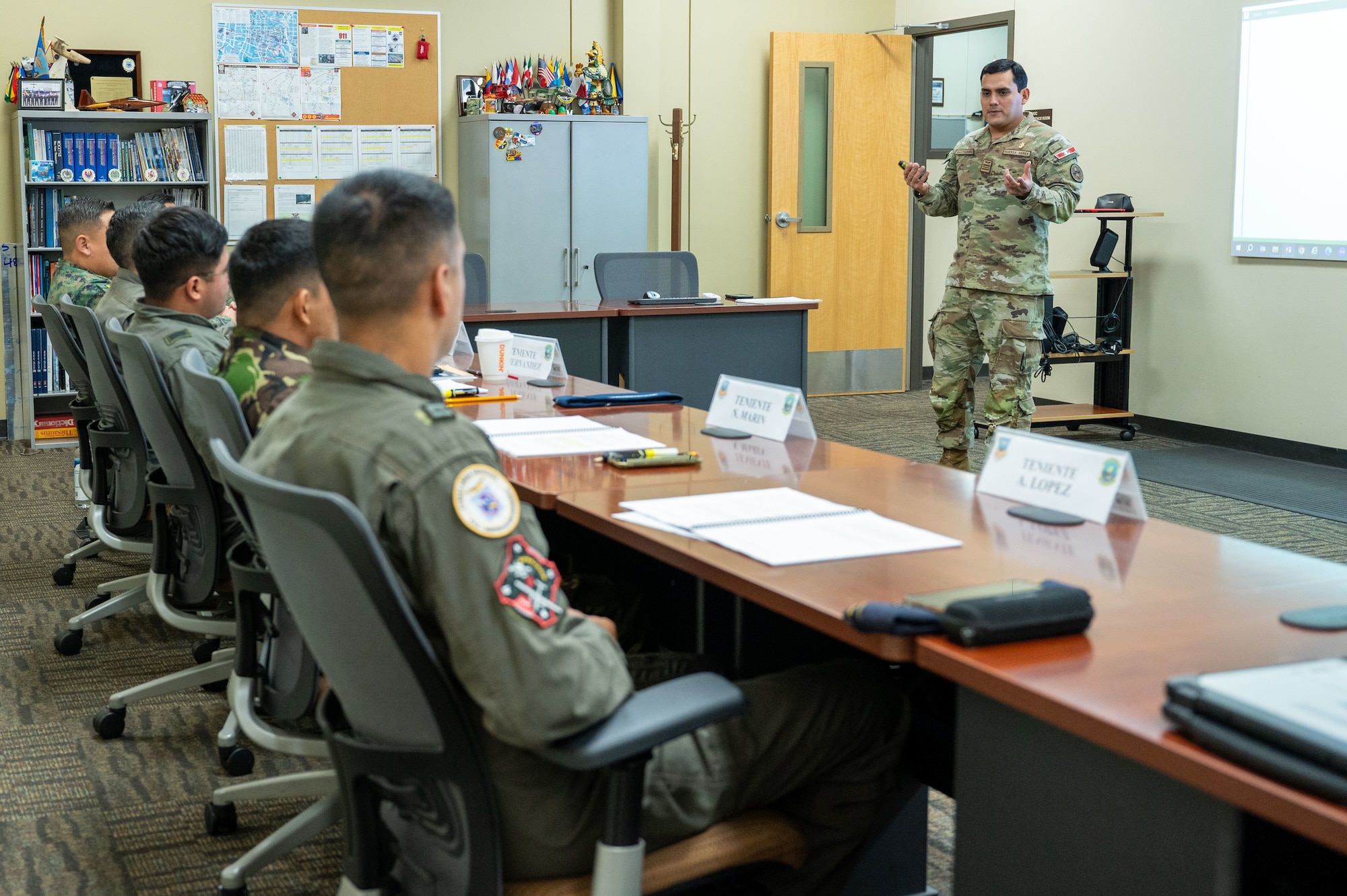 Maj. Jose Ricardo Gastiaburu, 837th Training Squadron, gestures with his hands during a class at the Inter-American Air Forces Academy on Joint Base San Antonio-Lackland, Texas, May 31, 2024. Gastiaburu, a Partner Nation Instructor from the Peruvian Air Force, currently teaches IAAFA’s Aircraft Maintenance Officer Course to international military students. Gastiaburu is a graduate of the United States Air Force Academy. Gastiaburu said USAFA provided him “a deeper understanding of the importance of building partnerships with countries across the globe.” (U.S. Air Force photo by Vanessa R. Adame)