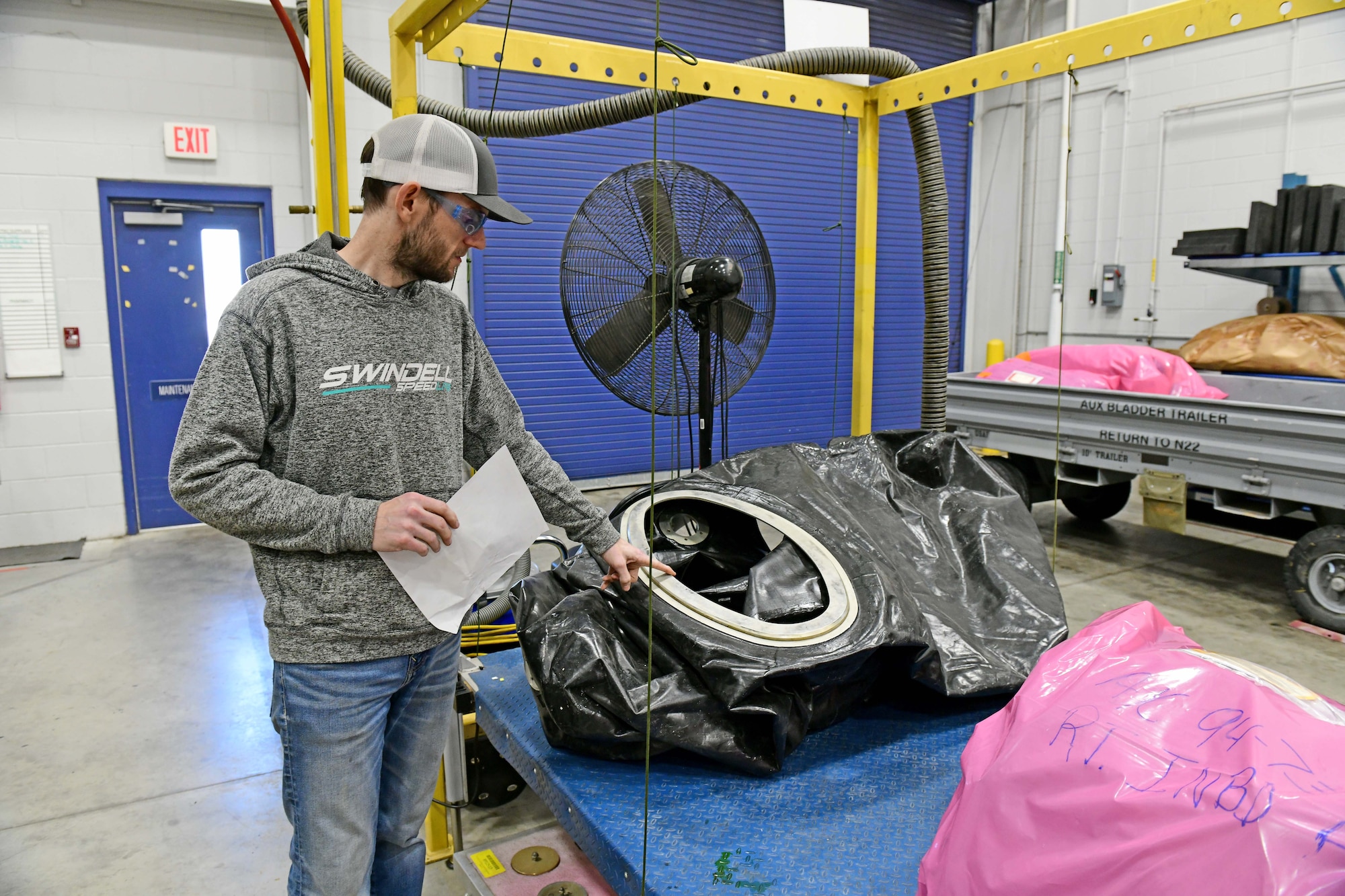 Man inspecting fuel bladder