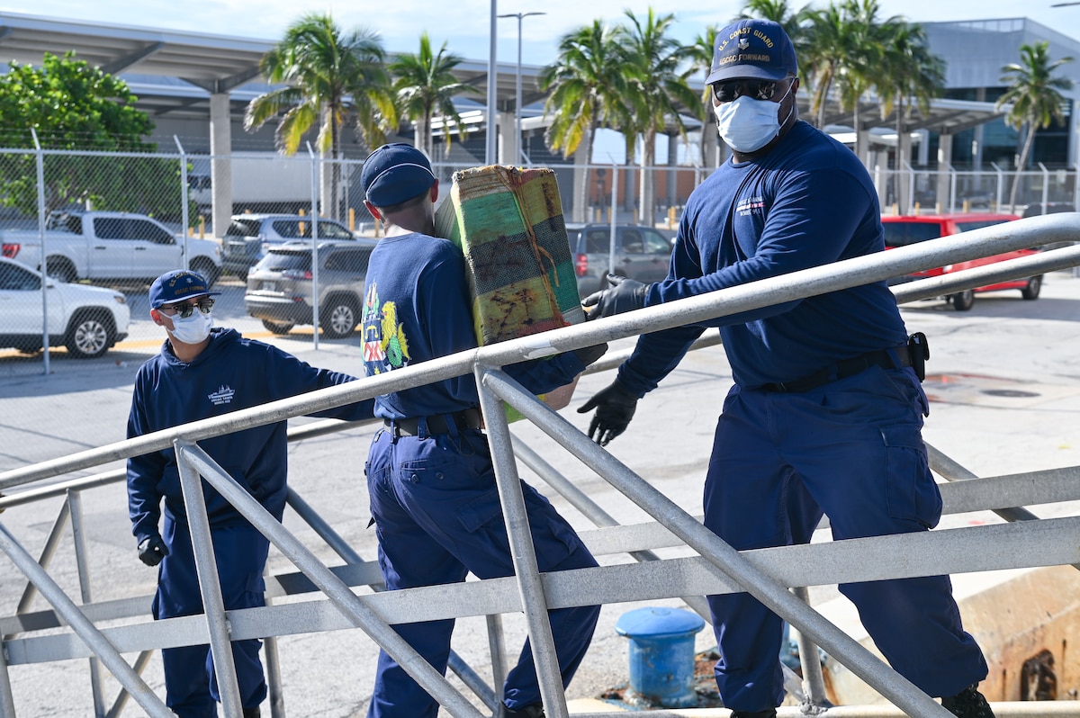 Crew members of the Coast Guard Cutter Forward offloading illicit drugs at Port Everglades, Florida, July 22, 2024. This offload was the result of three separate cases of drug smuggling in the Caribbean Sea. (U.S. Coast Guard photo by Petty Officer 3rd Class Nicholas Strasburg)