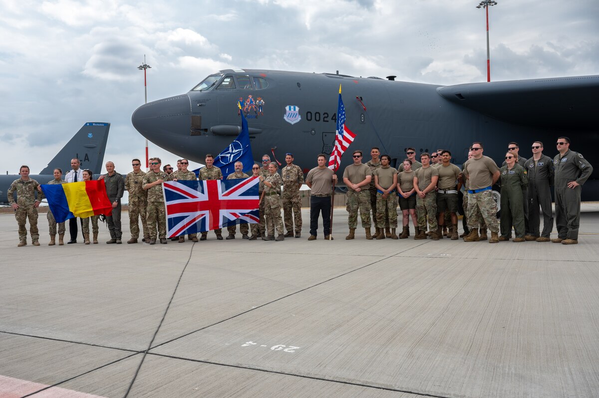 U.S., U.K., and Romanian Airmen pose for a group photo in front of a B-52H Stratofortress at Mihail Kogălniceanu Air Base, Romania, during Bomber Task Force Deployment 24-4, July 23, 2024. BTF 24-4 demonstrates NATO Allies and partners’ ability to seamlessly operate together and maintain a stable and prosperous Black Sea region. (U.S. Air Force Photo by Senior Airman Seth Watson)