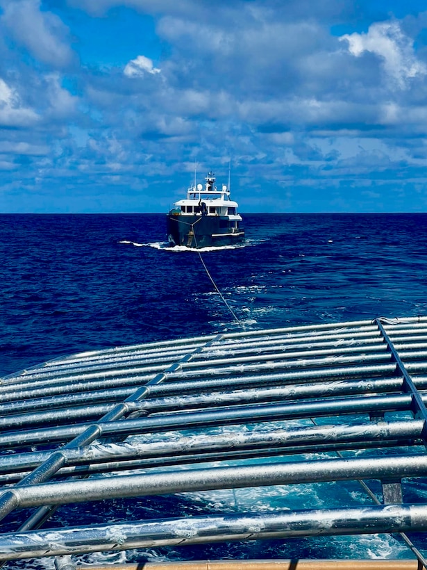 The crew of the USCGC Oliver Henry (WPC 1140) tow the motor yacht Black Pearl 1 and the 11 crew aboard in the Pacific Ocean, ensuring its safe arrival and mooring in the Republic of Palau on July 22, 2024, at 11:22 a.m. ChST, the Oliver Henry crew transferred the Black Pearl's tow to the 75-foot Palau-flagged tug SSC Techall, just offshore Palau. (U.S. Coast Guard photo by Petty Officer 3rd Class Noah Mummert)