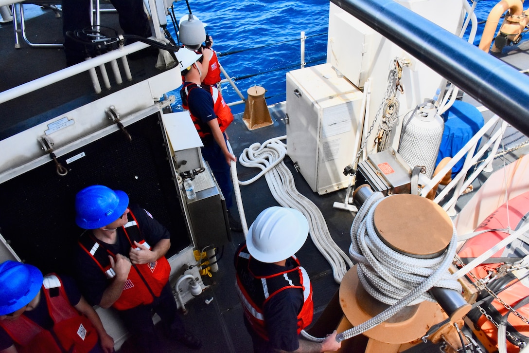 The crew of the USCGC Oliver Henry (WPC 1140) prepare to drop the tow as they complete the rescue operation of the motor yacht Black Pearl 1 and the 11 crew aboard, ensuring its safe arrival and mooring in the Republic of Palau on July 22, 2024. At 11:22 a.m. ChST, the Oliver Henry crew transferred the Black Pearl's tow to the 75-foot Palau-flagged tug SSC Techall, just offshore Palau. (U.S. Coast Guard photo)