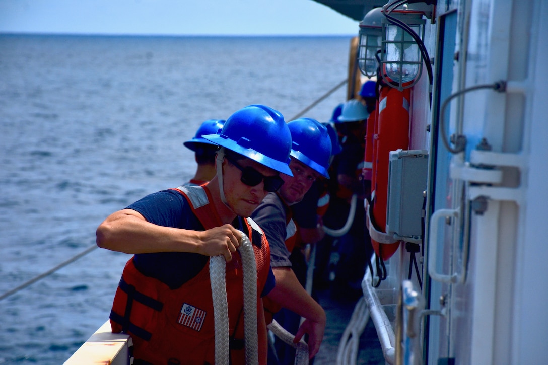 The crew of the USCGC Oliver Henry (WPC 1140) prepare to drop the tow as they complete the rescue operation of the motor yacht Black Pearl 1 and the 11 crew aboard, ensuring its safe arrival and mooring in the Republic of Palau on July 22, 2024. At 11:22 a.m. ChST, the Oliver Henry crew transferred the Black Pearl's tow to the 75-foot Palau-flagged tug SSC Techall, just offshore Palau. (U.S. Coast Guard photo)