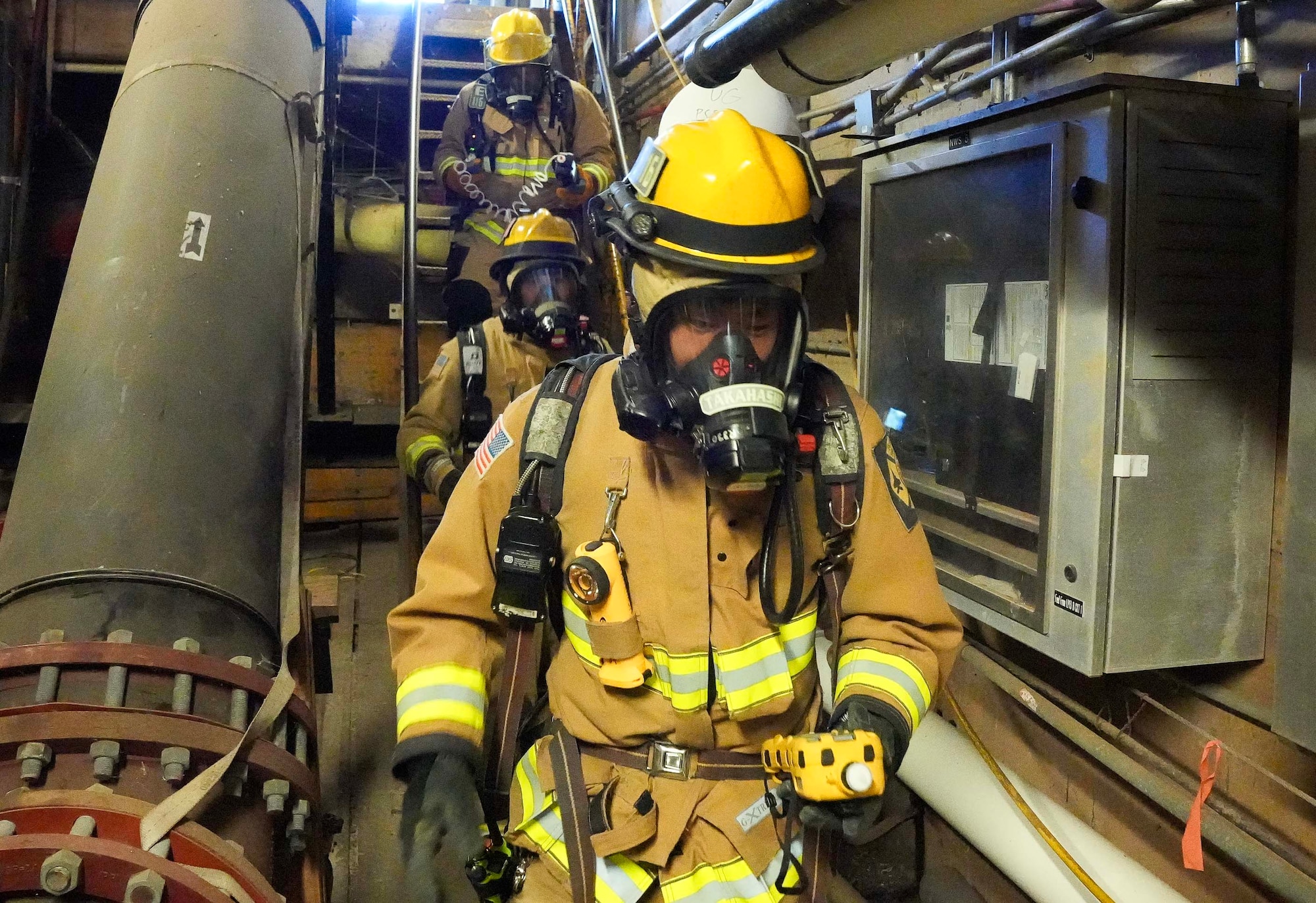 HALAWA, Hawaii (July 22, 2024) Members of the Federal Fire Department, Navy Region Hawaii simulate checking for levels of volatile organic compounds in the air during a joint spill drill exercise with Navy Closure Task Force - Red Hill (NCTF-RH) at the Red Hill Bulk Fuel Storage Facility (RHBFSF) in Halawa, Hawaii, July 22, 2024. The exercise tested the Navy’s emergency response capabilities and its ability to work with multiple agencies to respond to a spill consisting of a mixture of water and cleaning solution at the facility in preparation for pressure washing operations. Charged with the safe decommissioning of the facility, NCTF-RH was established by the Department of the Navy as a commitment to the community and the environment, and continues to engage with the people of Hawaii, regulatory agencies, and other stakeholders as it safely and deliberately decommissions the RHBFSF. (U.S. Navy photo by Mass Communication Specialist 1st Class Glenn Slaughter)