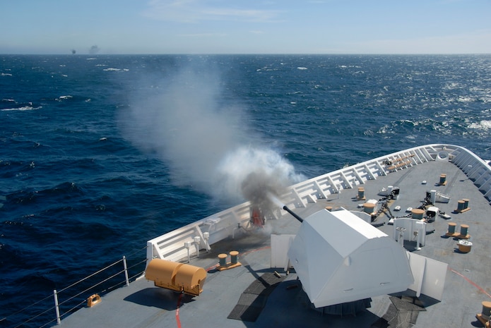 Coast Guard Cutter BERTHOLF's 57mm gun fires at an unmanned aerial vehicle drone Feb. 26, 2009.