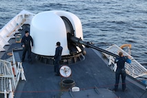 The crew of the Coast Guard Cutter Munro from Kodiak, Alaska, fire the cutter’s 76mm gun during a gunnery exercise in the Bering Sea Nov. 16, 2014.