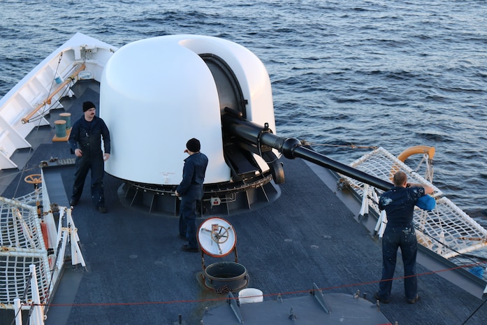 The crew of the Coast Guard Cutter Munro from Kodiak, Alaska, fire the cutter’s 76mm gun during a gunnery exercise in the Bering Sea Nov. 16, 2014.