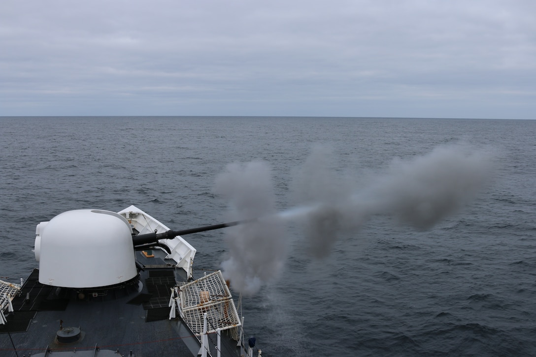 The crew of the Coast Guard Cutter Munro from Kodiak, Alaska, fire the cutter’s 76 mm gun during a gunnery exercise in the Bering Sea Nov. 24, 2014.