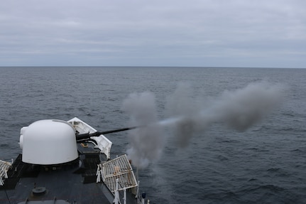 The crew of the Coast Guard Cutter Munro from Kodiak, Alaska, fire the cutter’s 76 mm gun during a gunnery exercise in the Bering Sea Nov. 24, 2014.