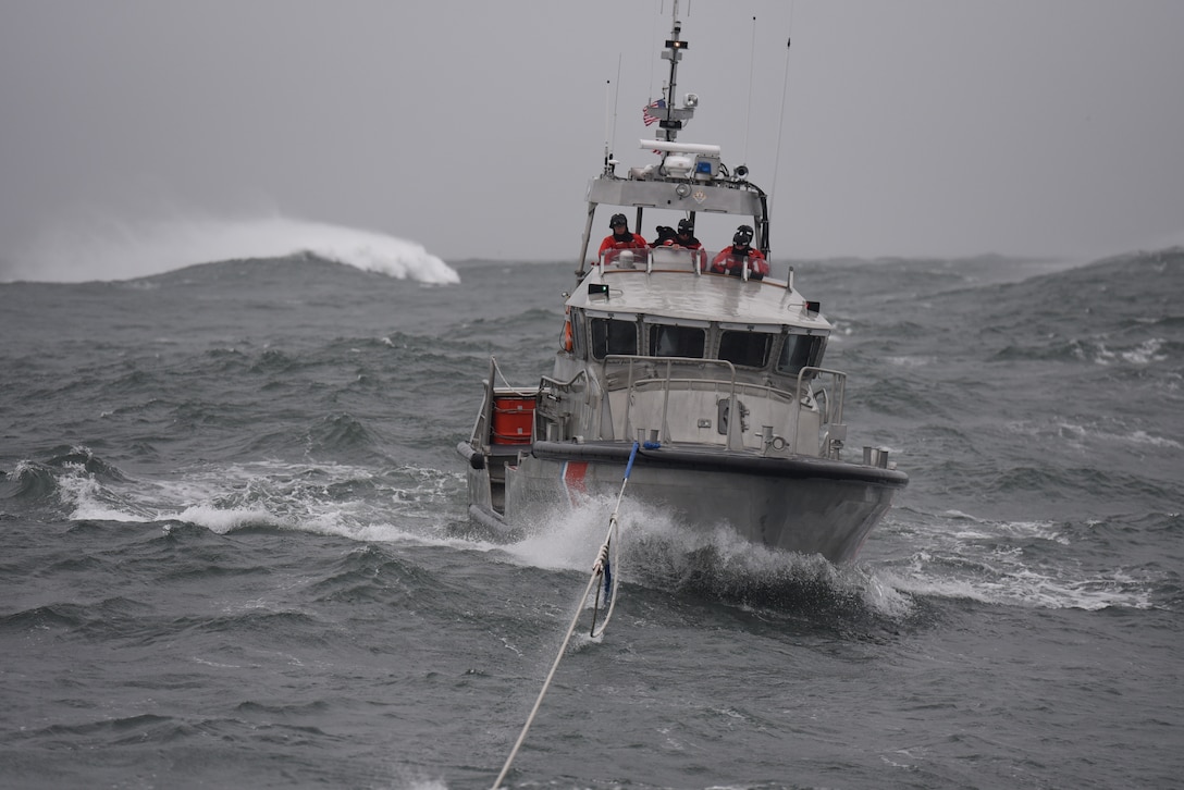 A 47-foot Motor Lifeboat [MLB] from Coast Guard Station Cape Disappointment is towed by another MLB from the station during drills off the Washington Coast on Nov. 14, 2020.