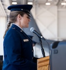 U.S. Air Force 1st Lt. Catherine Trevor-Roberts, 16th Special Operations Aircraft Maintenance Squadron chaplain, gives the benediction during a ceremony that simultaneously realigned the 6th Special Operations Squadron and activated the 6th Special Operations Aircraft Maintenance Squadron under the 492nd Special Operations Wing, July 9, 2024, at Cannon Air Force Base, New Mexico.