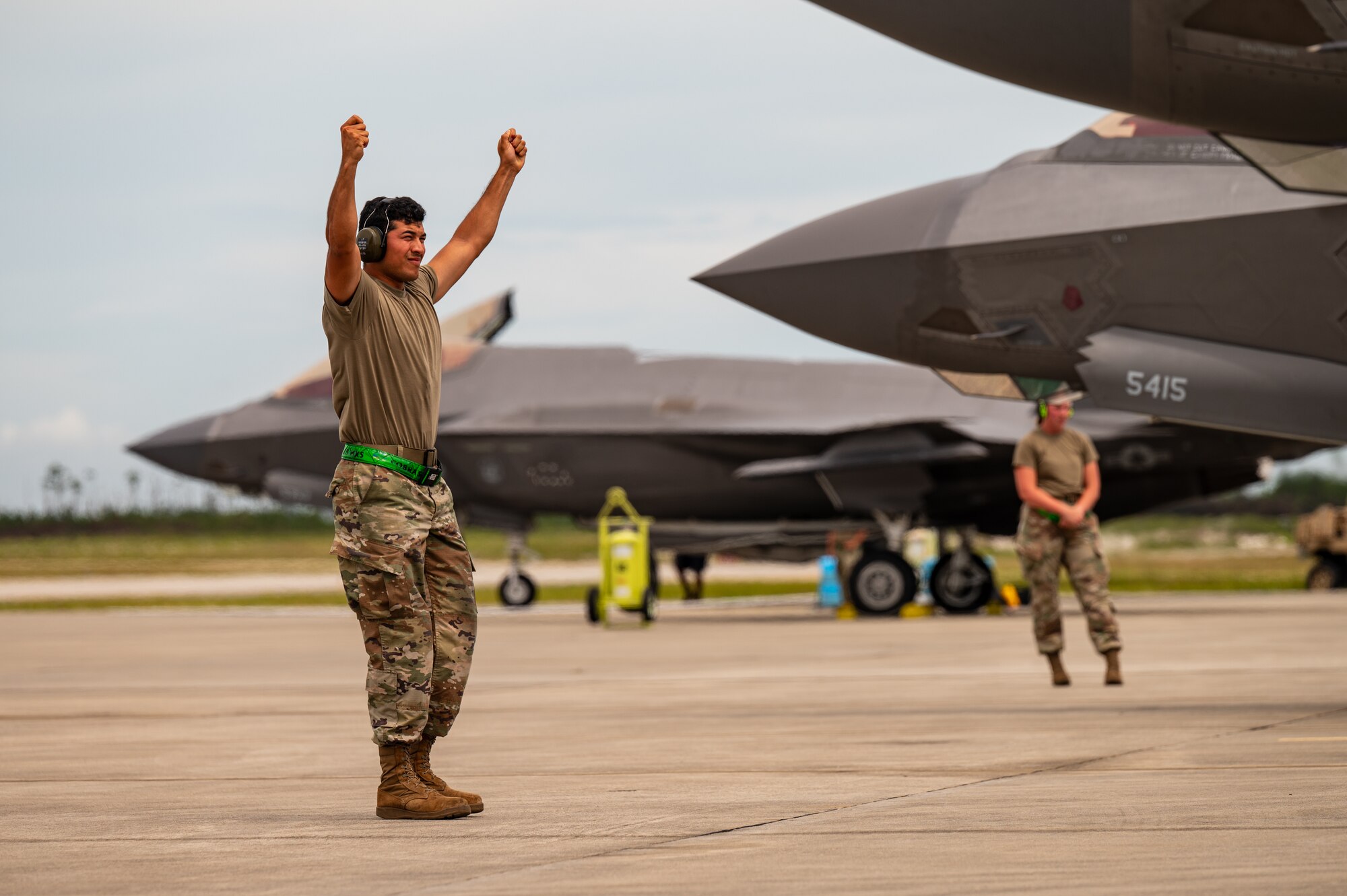 An airmen stands on the flight line