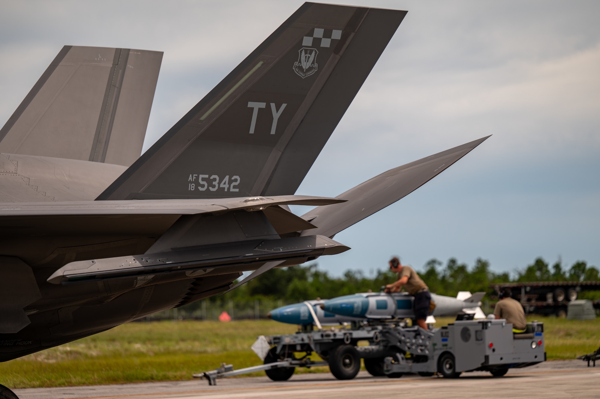 An aircraft tail is on the flight line