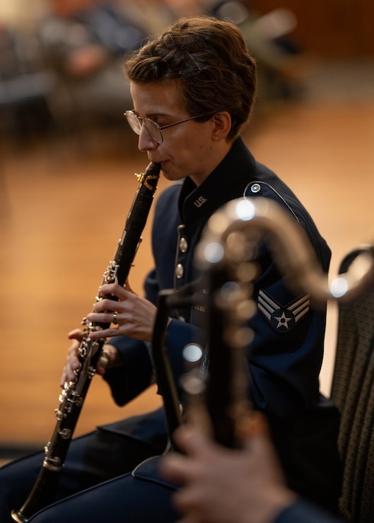 Air force clarinetist performs at a change of command.