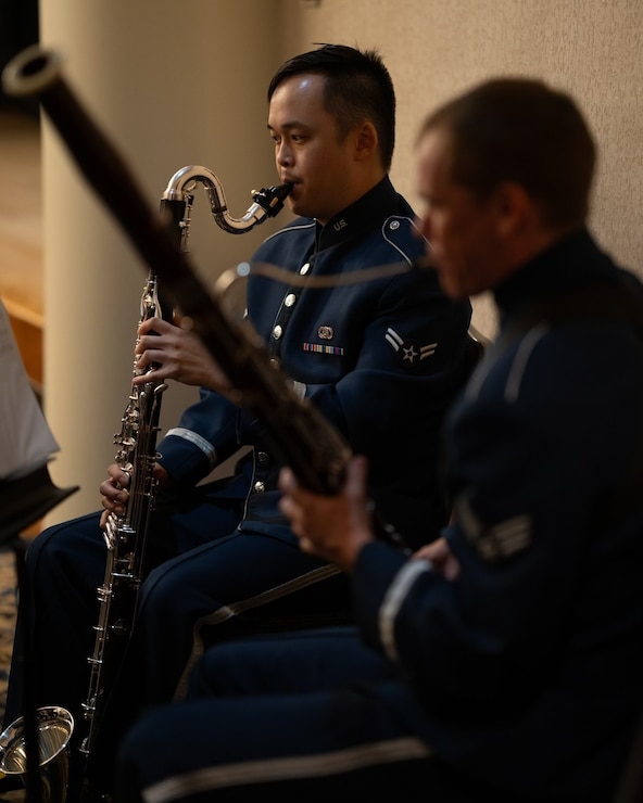 Air force clarinetist and bassoonist perform at a change of command.