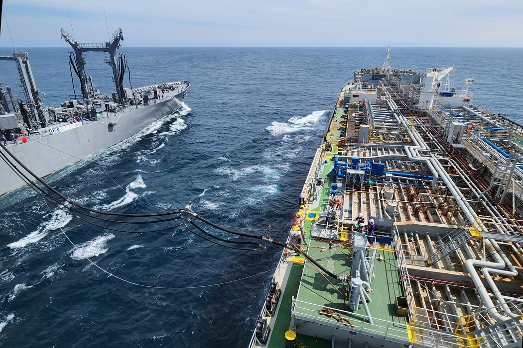 Japan Maritime Self-Defense Force oiler JS Hamana (AO-424) connects its fuel line to Military Sealift Command’s commercial charter oiler MT Badlands Trader during ships qualification training at sea West of Kyushu, Japan, July 23, 2024