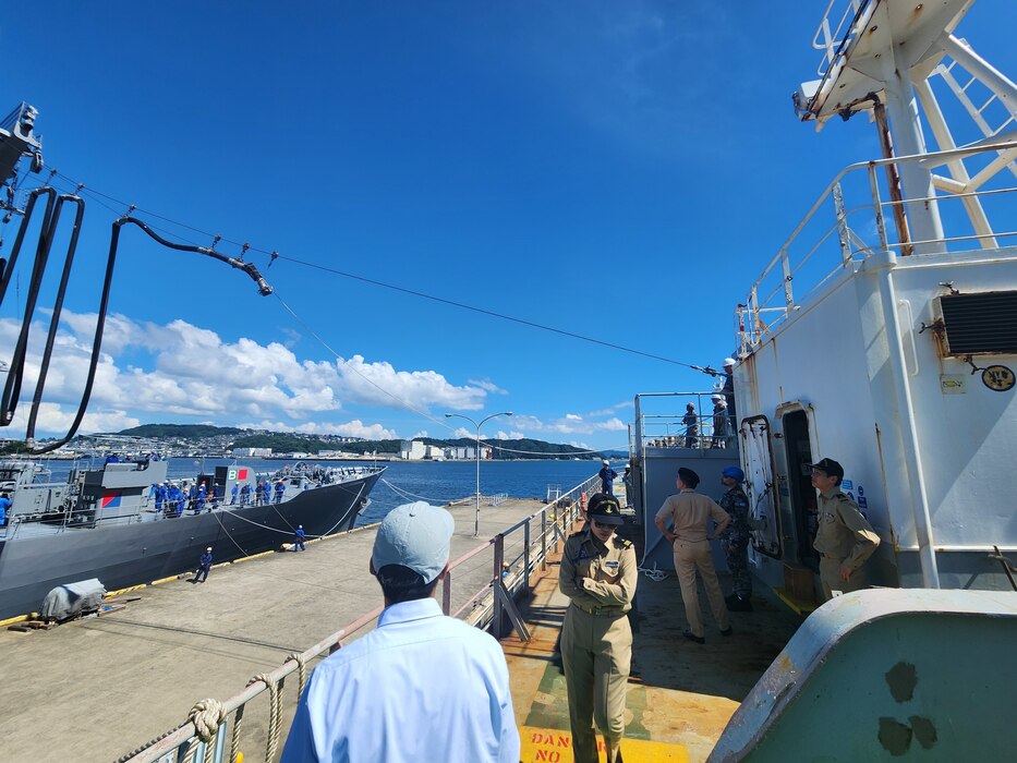 Japan Maritime Self-Defense Force oiler JS Hamana (AO-424) deploys its fuel lines toward Military Sealift Command’s commercial charter oiler MT Badlands Trader during ships qualification training at a pier on board U.S. Fleet Activities Sasebo, Japan, July 22, 2024