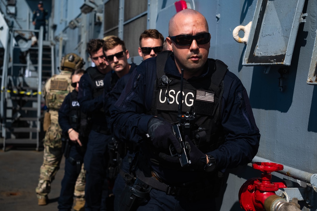 Boarding team members from the U.S. Coast Guard Cutter James (WMSL 754) board the Brazilian navy Amazonas (P 120) in the southern Atlantic Ocean, May 25, 2024. The boarding team practiced boarding procedures onboard the Amazonas during Operation Southern Cross 2024. (U.S. Coast Guard photo by Petty Officer 3rd Class Logan Kaczmarek)