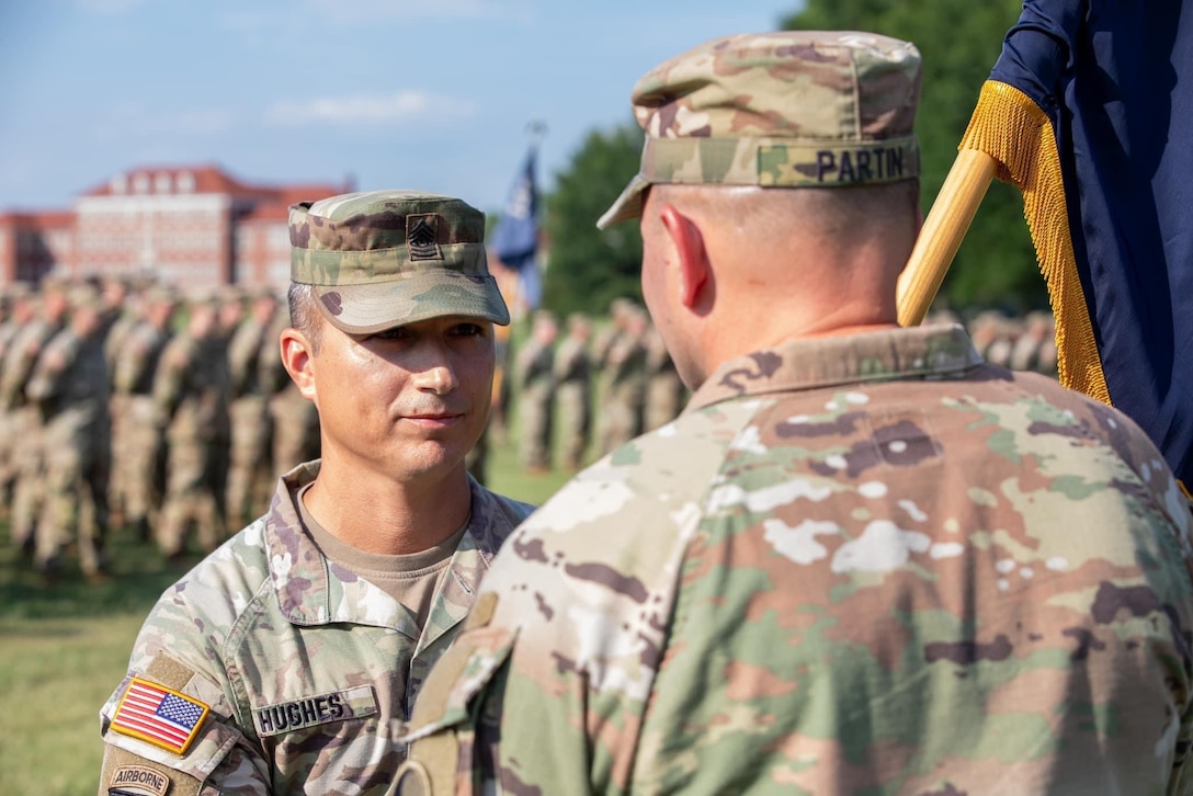 The 1st Battalion, 149th Infantry Regiment conducts a Change of Responsibility ceremony between outgoing Command Sgt. Maj. Anthony Hughes and incoming Command Sgt. Maj. Tim Lewis, during annual training at Fort Knox, Kentucky, July 20,2024