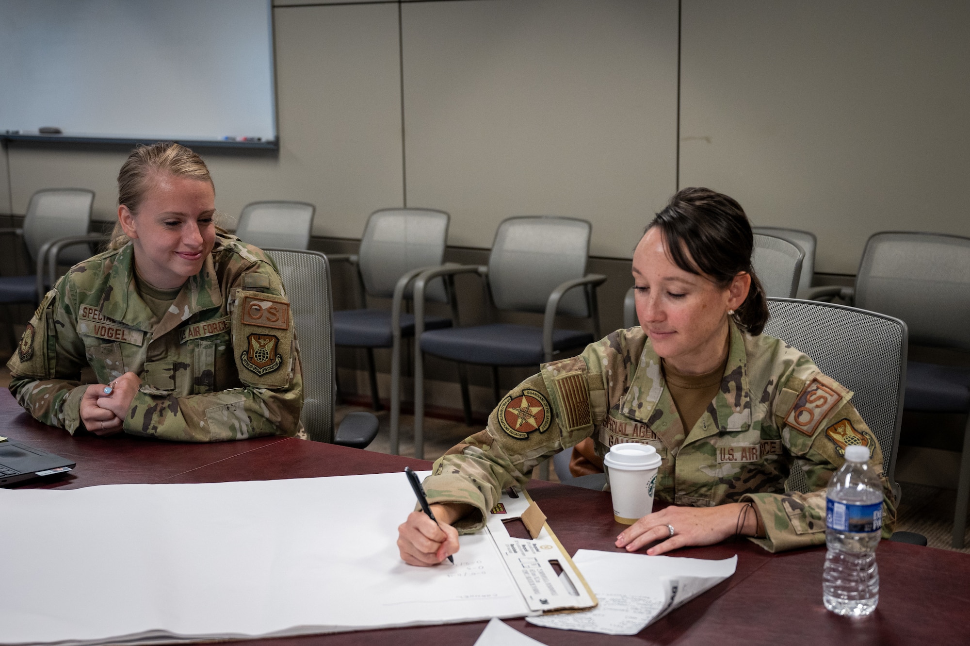 Special Agents break into groups for a mentorship exercise during the Officer Special Agent Advisory Group in-person sync at the Russell-Knox Building in Quantico, Virginia.