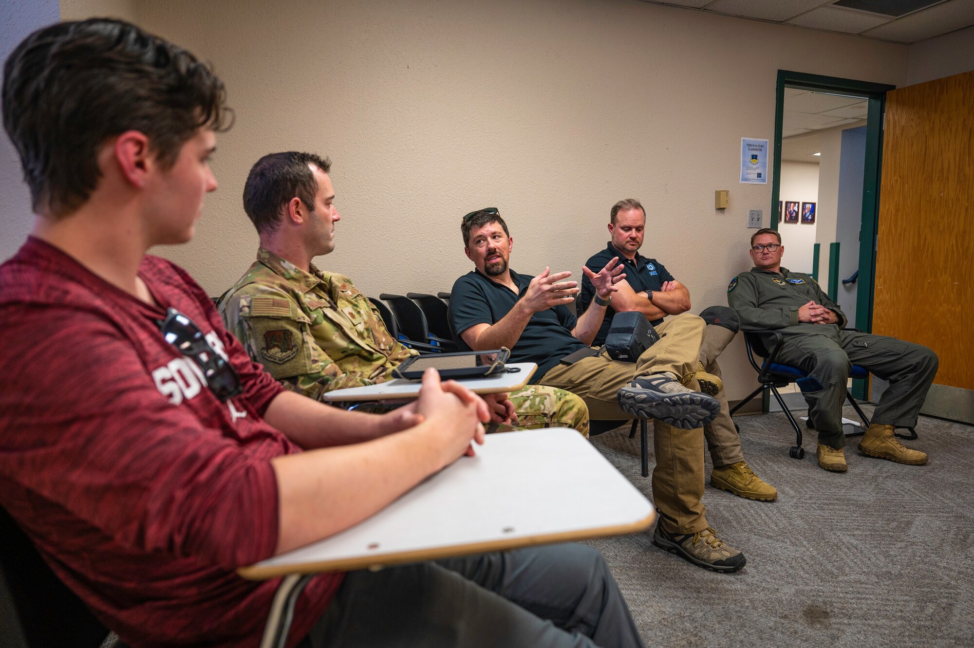 Group of men have a discussion.