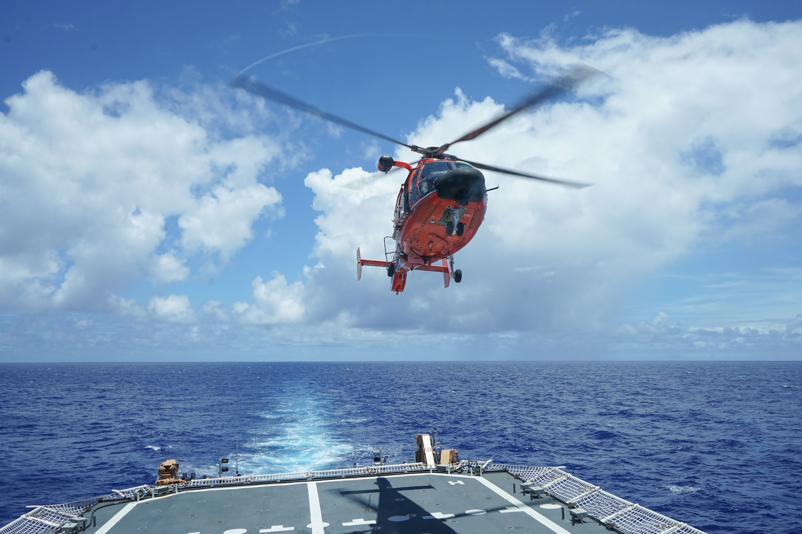 An embarked Coast Guard Helicopter Interdiction Tactical Squadron MH-65 Dolphin helicopter conducts flight operations from Coast Guard Cutter Stone, (WMSL 758), June 22, 2024, while underway in the Atlantic Ocean. Stone is operating in the Atlantic Ocean in support of maritime stability and security in the region. (U.S. Coast Guard photo by Petty Officer 3rd Class Joanna Burzo)