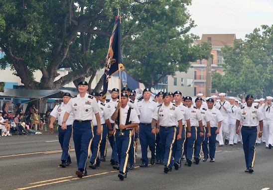 Task Force Talon personnel led by the Task Force Talon commander, Lieutenant Colonel Jonthan Stafford march in the 80th Guam Liberation Day Parade.