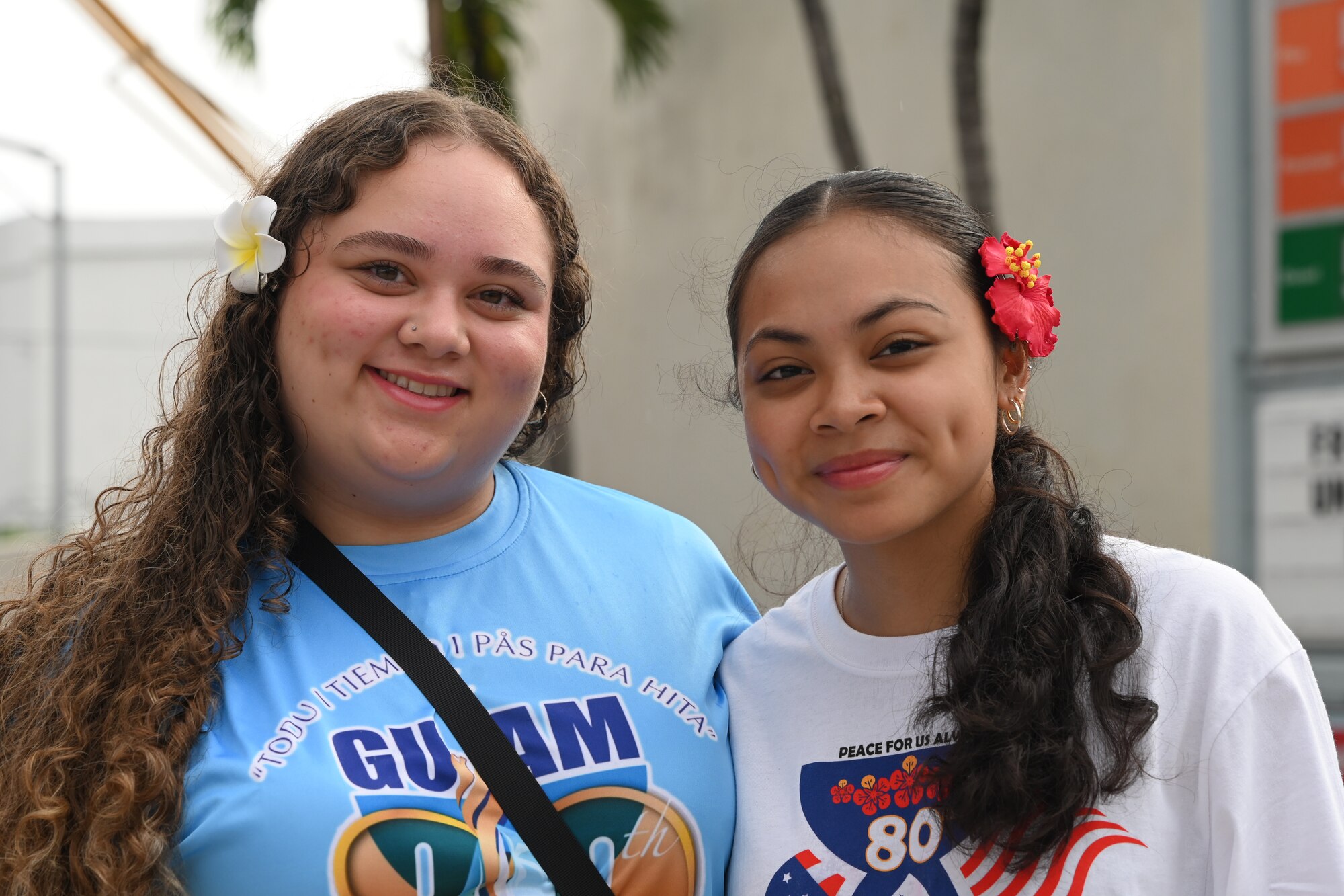 Attendees of the 80th Liberation Day Parade smile in Hagatna, Guam, July 21, 2024. Thousands of people across Guam participate in events like the Liberation Day parade to celebrate and thank the U.S. military for their efforts in the liberation of Guam during World War II. (U.S. Air Force photo by Airman 1st Class Adasha Williams)