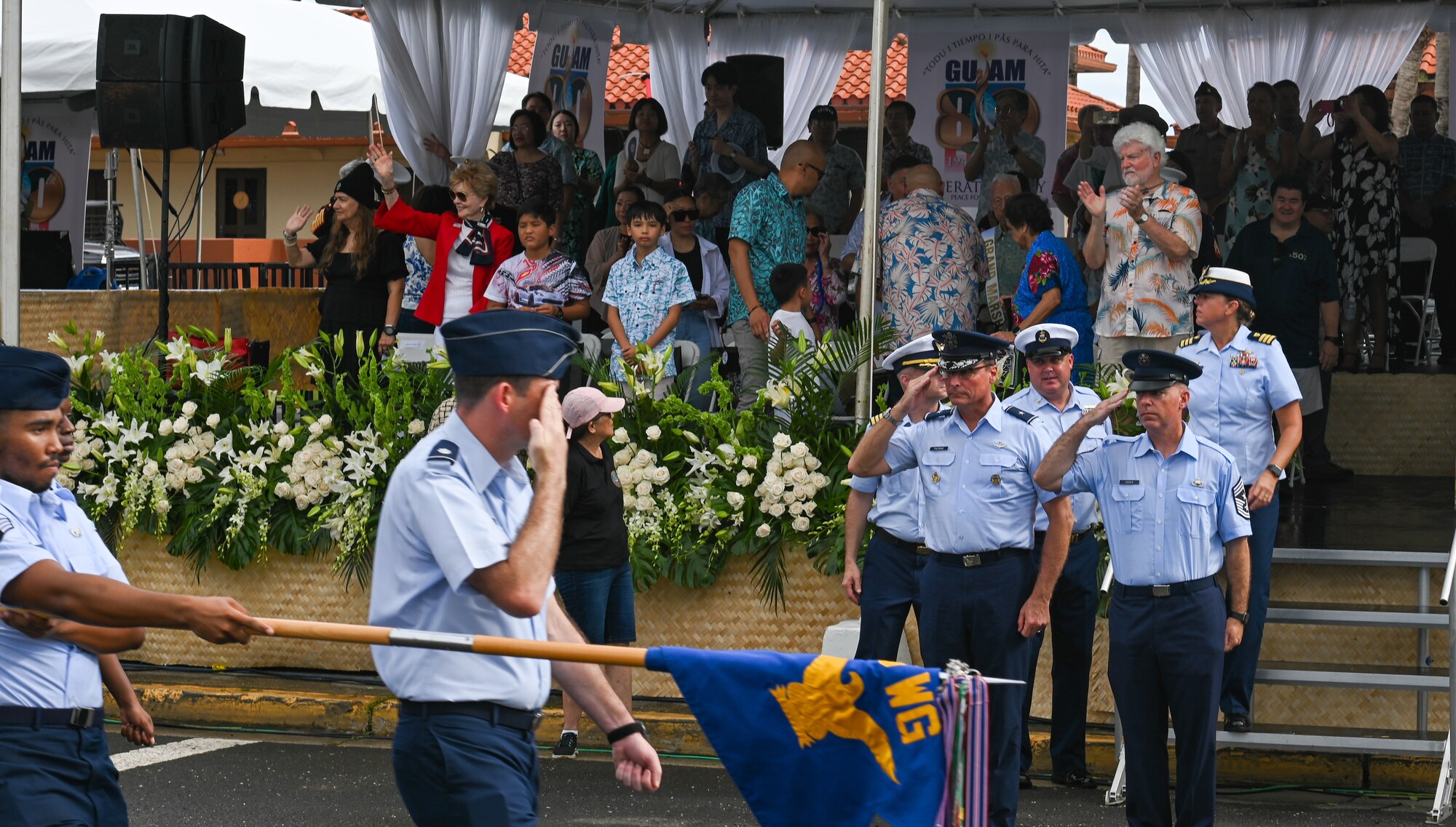 U.S. Air Force Brig. Gen. Thomas Palenske, 36th Wing commander, and Chief Master Sgt. Timothy Hodgin, 36th Wing command chief, salutes the Air Force formation during the 80th Liberation Day Parade at Hagatna, Guam, July 21, 2024. The parade is a celebration of U.S. forces liberating Guam during World War II and culminates in events and ceremonies held across the island.