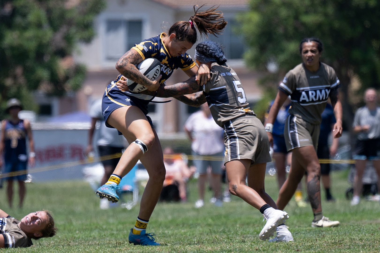 Navy Ensign Megan Neyen breaks a tackle  during the 2024 Armed Forces Women’s Rugby Championships in San Diego, California, July 12, 2024. (DoD photo by EJ Hersom)