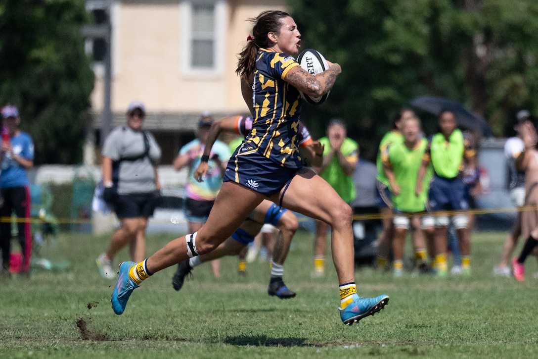 Navy Ensign Megan Neyen breaks away on a scoring run during the 2024 Armed Forces Women’s Rugby Championships in San Diego, California, July 13, 2024. (DoD photo by EJ Hersom)