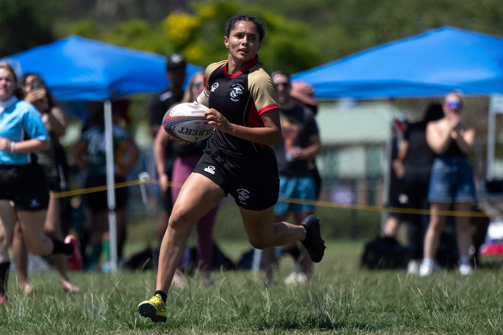 Marine Corps Sgt. Vivian Aragon breaks away on a scoring run during the 2024 Armed Forces Women’s Rugby Championship in San Diego, California, July 12, 2024. (DoD photo by EJ Hersom)