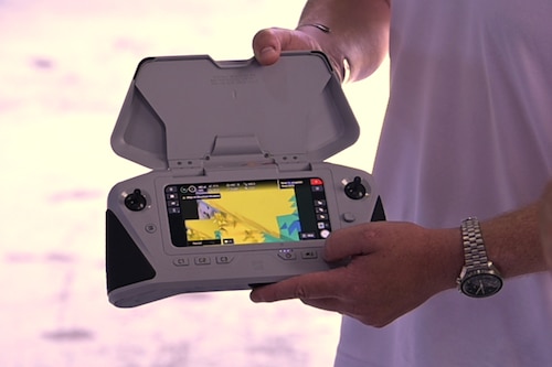 Photo of a representative demonstrating how a drone controller for a Skydio unmanned aerial system can be used.