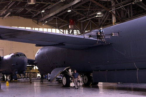Photo of an unmanned aerial system being flown near a B-52 Stratofortress at Barksdale Air Force Base