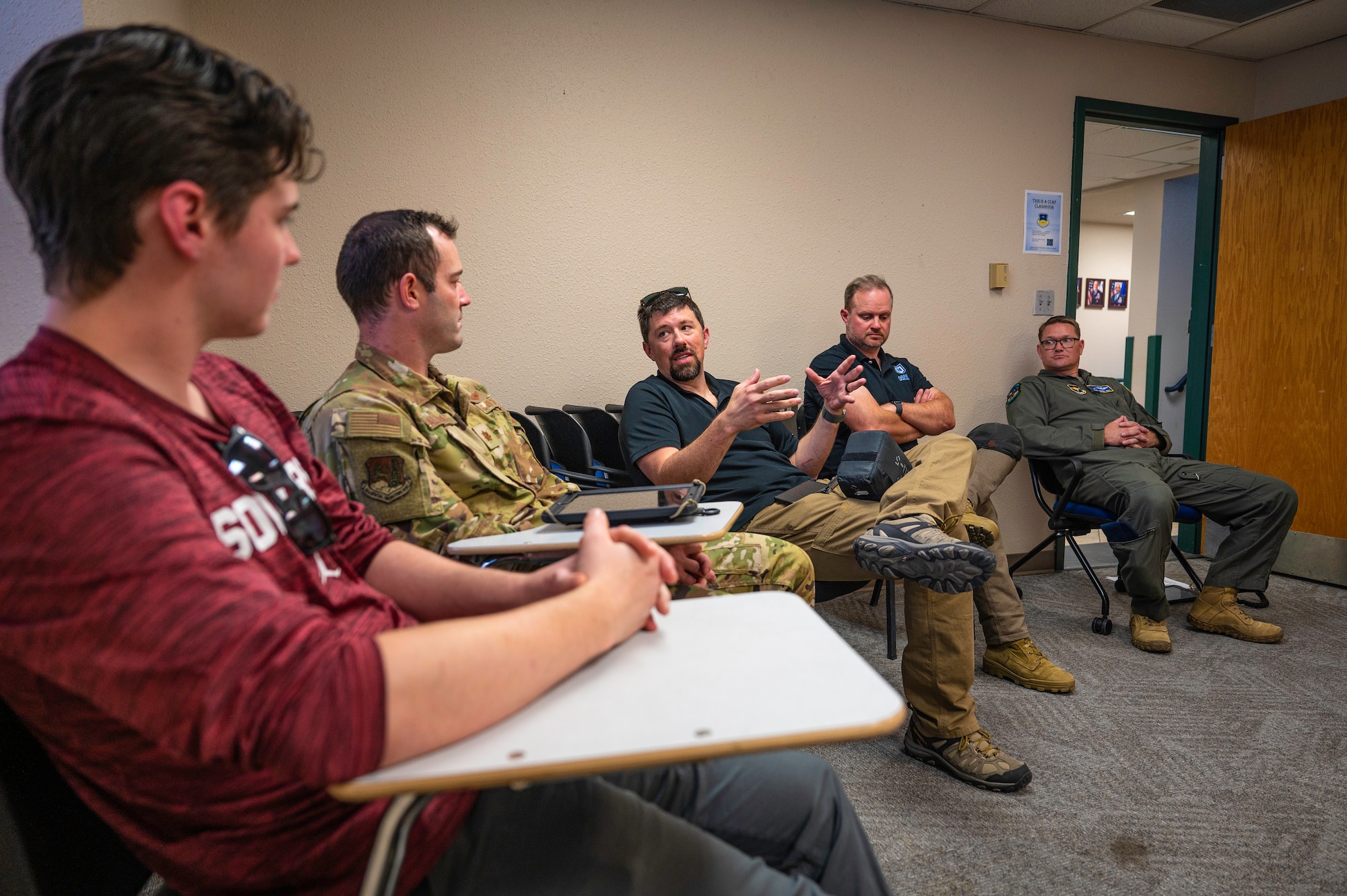 Group of men have a discussion.
